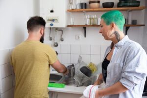 Couple washing dishes